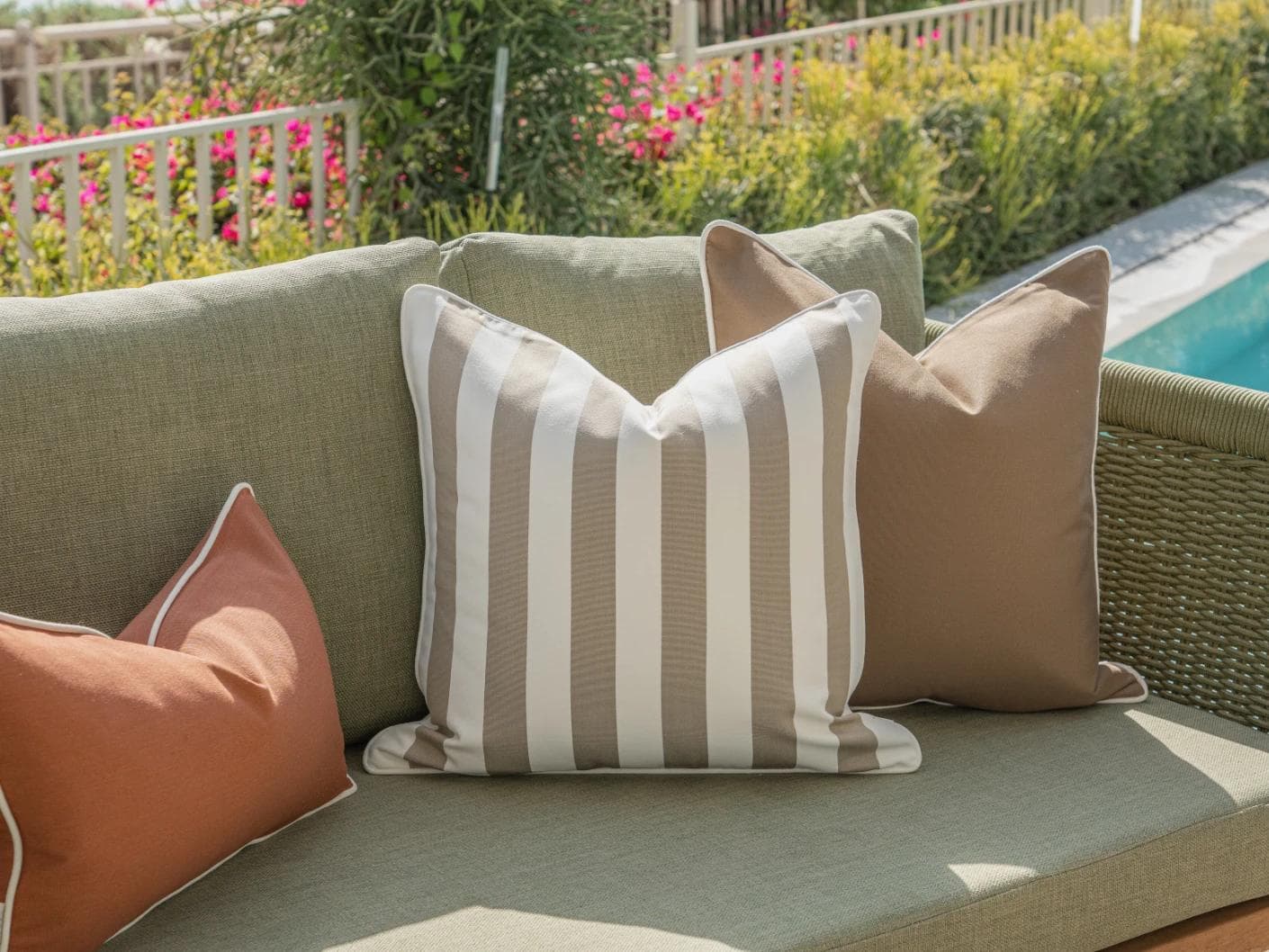 Imani Bundle cushion in brown and rust, shown in a lifestyle left view as image 5