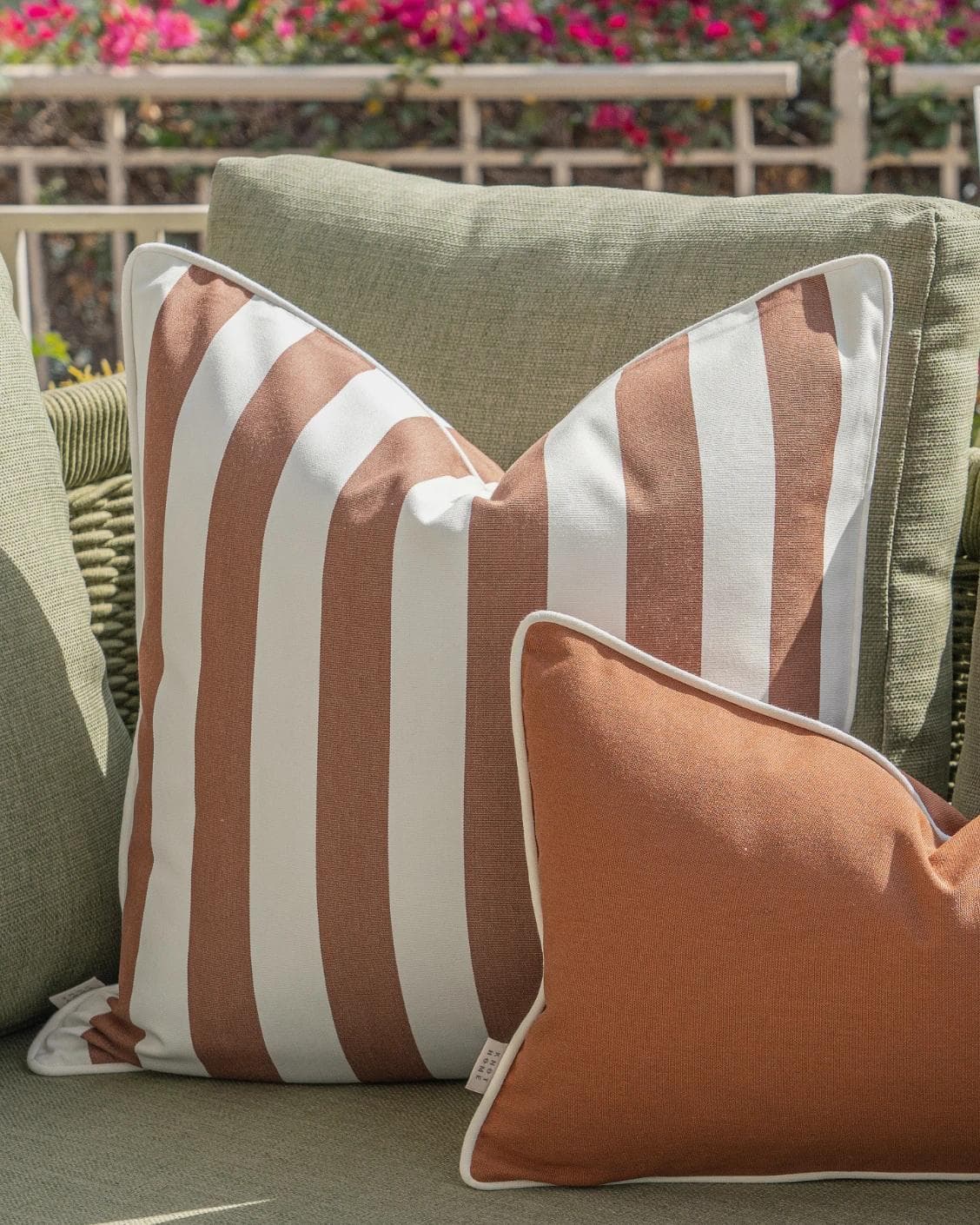Imani Bundle cushion in brown and rust, shown in a lifestyle right view as image 6
