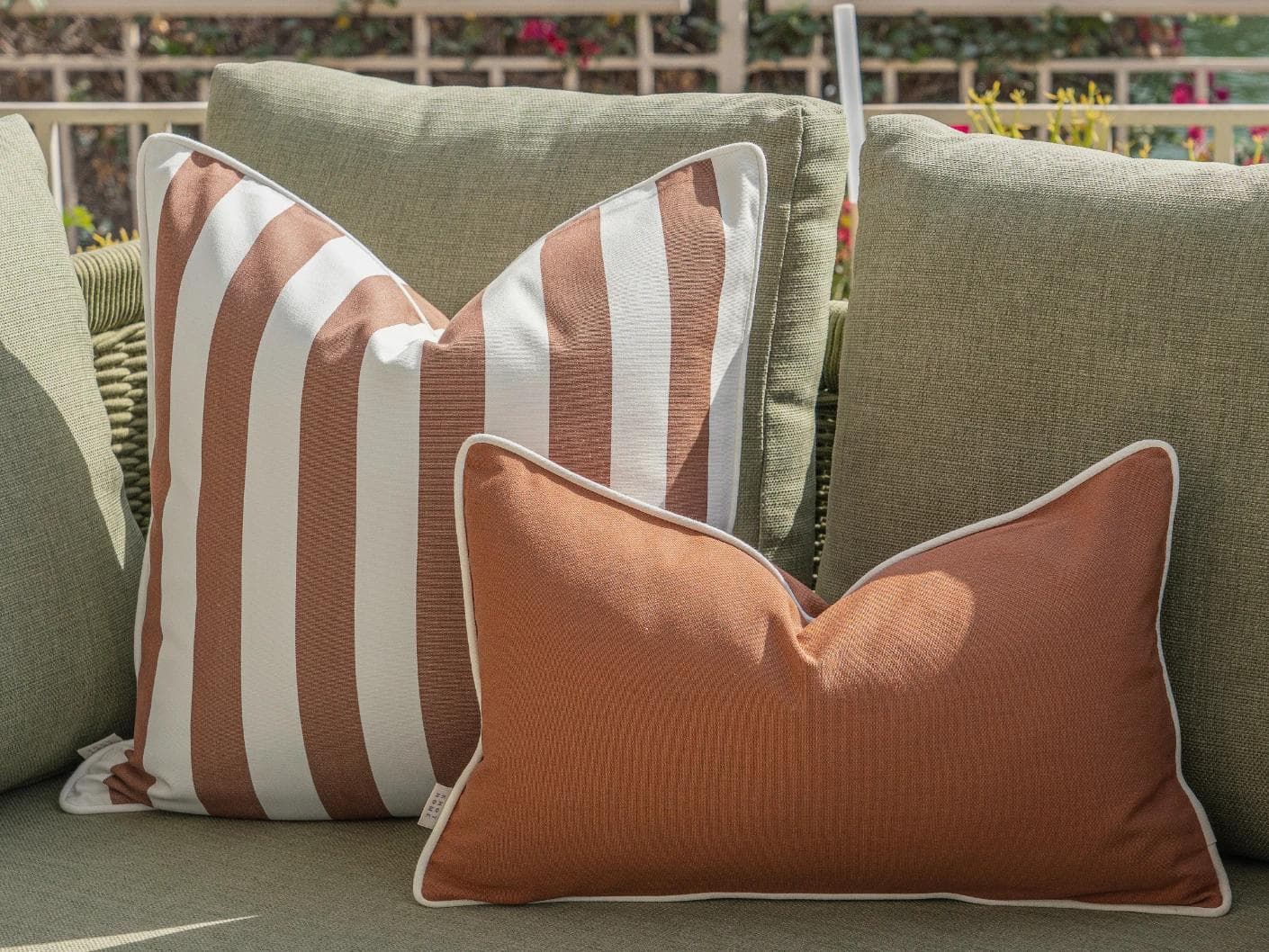 Imani Bundle cushion in brown and rust, shown in a lifestyle right view as image 6