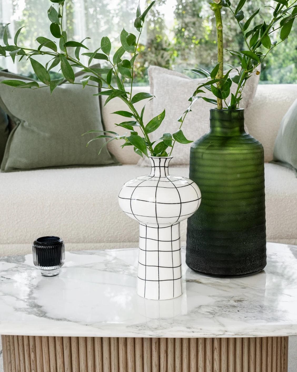 Iris Arneson vases in white and black, shown in a lifestyle front view as image 2