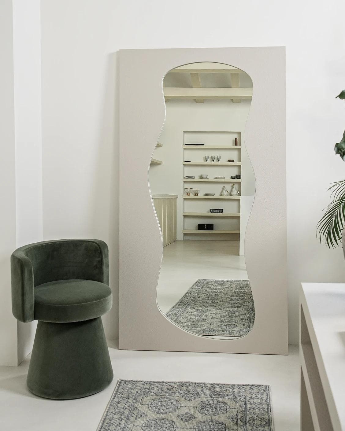 Ivrea mirror in soft ivory and stone, shown in a lifestyle front view as image 2