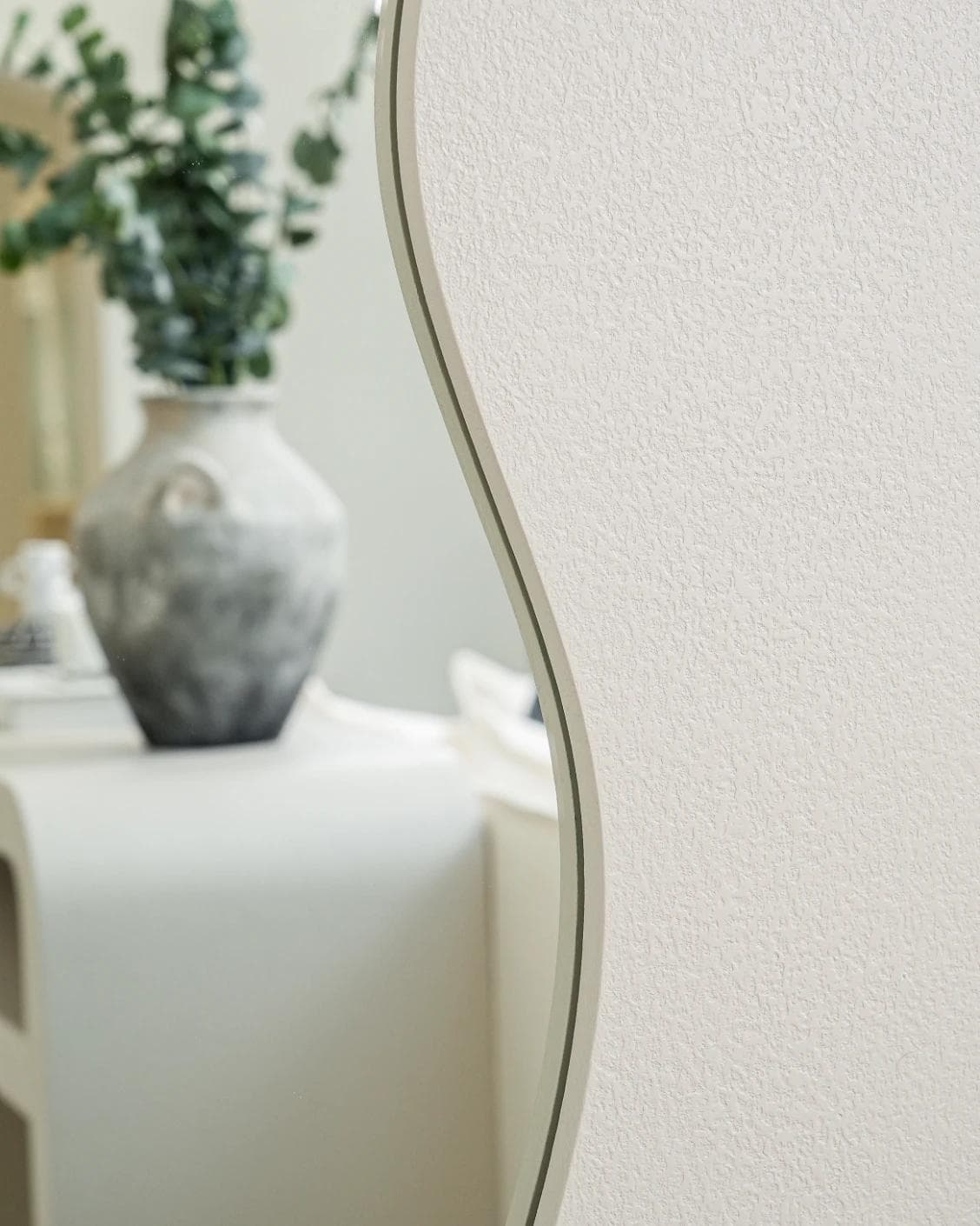 Ivrea mirror in soft ivory and stone, shown in a lifestyle front view as image 5