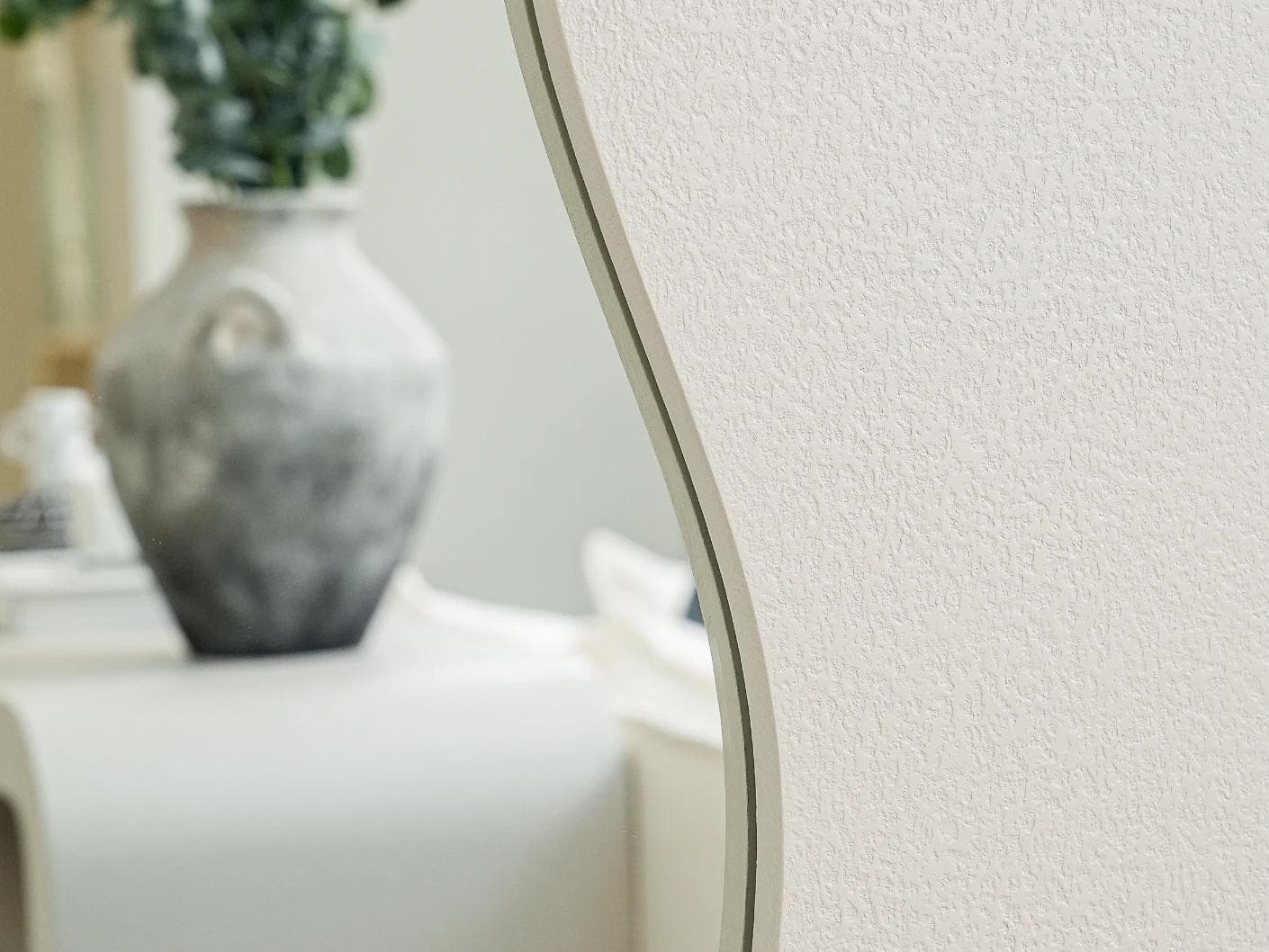 Ivrea mirror in soft ivory and stone, shown in a lifestyle front view as image 5