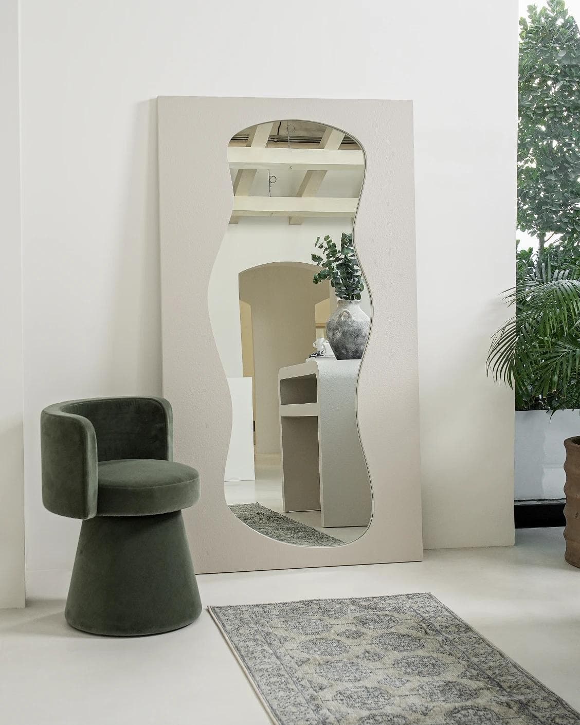 Ivrea mirror in soft ivory and stone, shown in a lifestyle left view as image 6