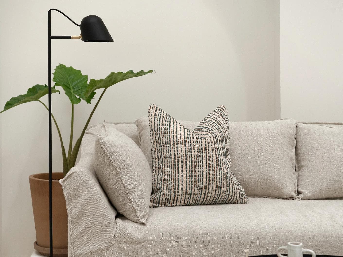 Izzy Canova cushion in ivory and multicolour, shown in a lifestyle front view as image 4