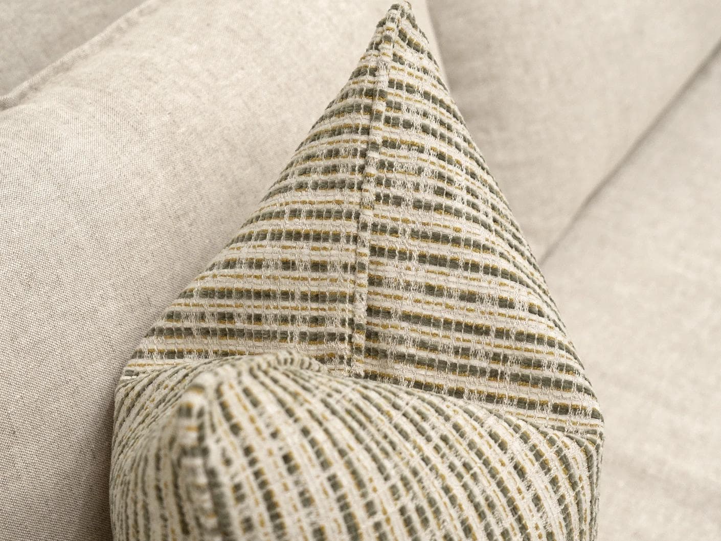 Izzy Olive cushion in ivory, shown in a lifestyle top view as image 5