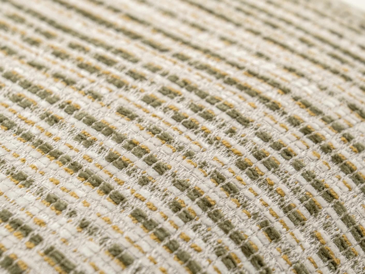 Izzy Olive cushion in ivory, shown in a product close-up as image 6