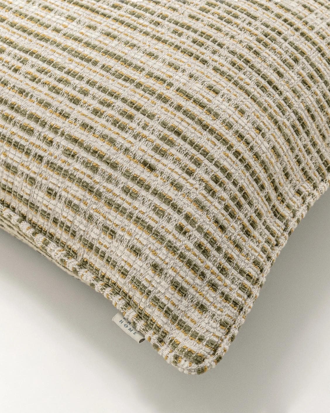 Izzy Olive cushion in ivory, shown in a product top view as image 8