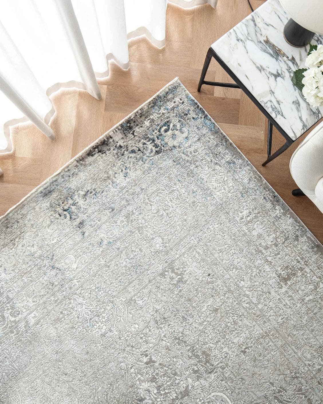 Jacob Alba carpet in grey, shown in a lifestyle top view as image 2