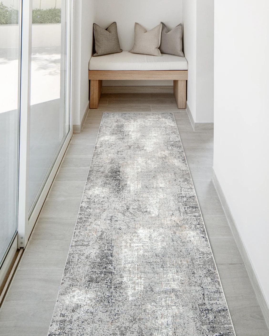 Jacob Ashton Runners carpet in grey, silver and white, shown in a lifestyle front view