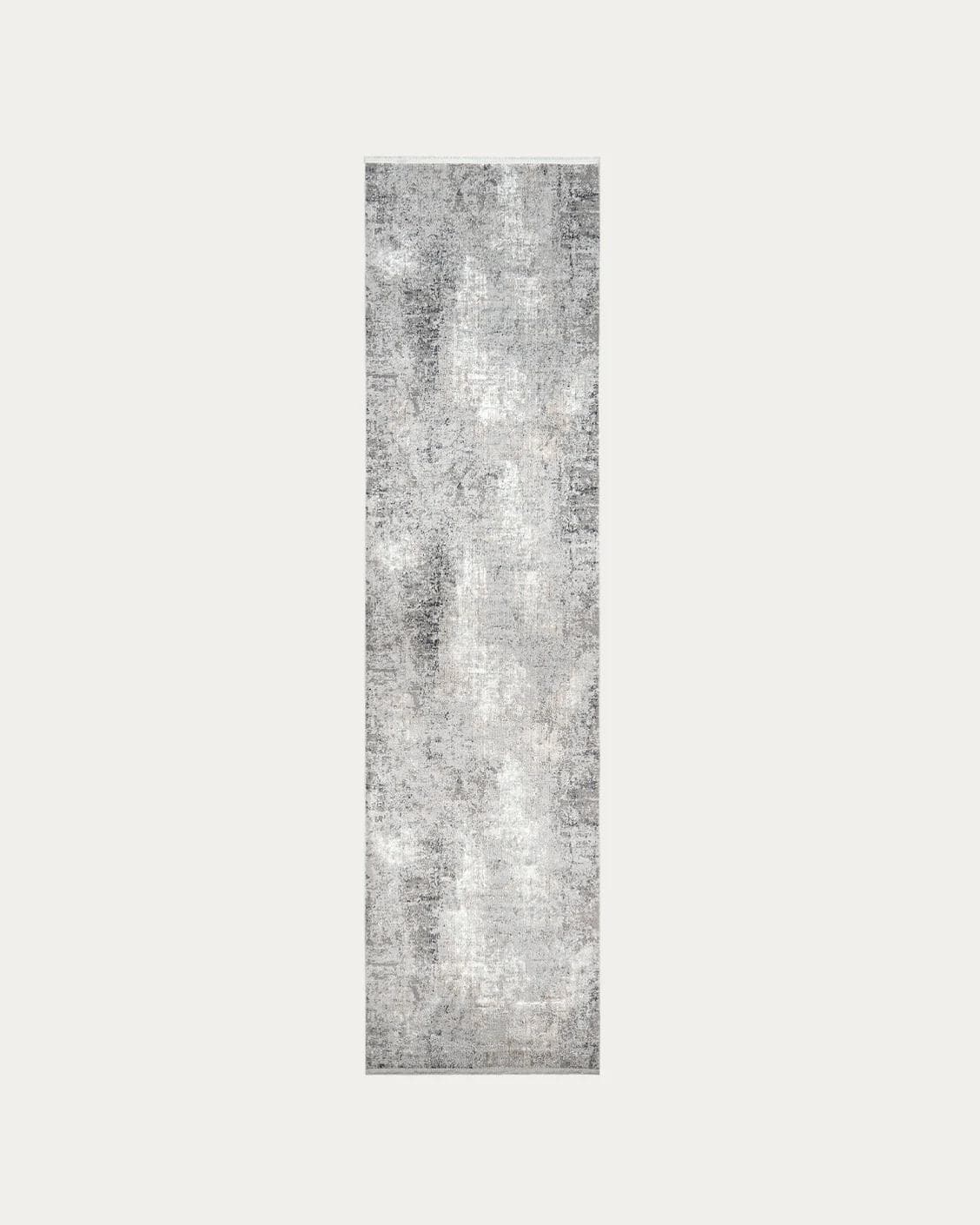 Jacob Ashton carpets in grey, silver and white, shown in a product top view as image 1