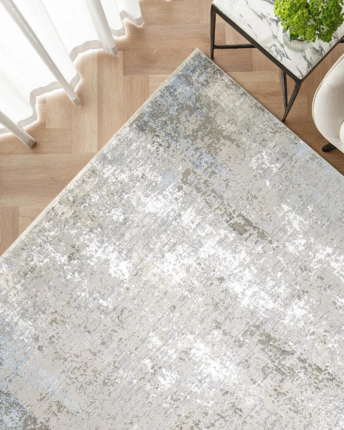 Jacob Azure carpet in grey and blue, shown in a lifestyle top view as image 2