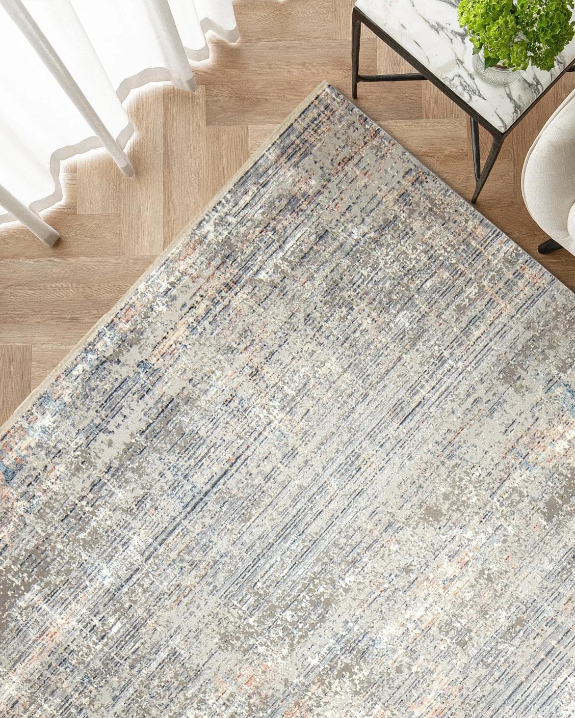 Jacob Sandy carpet in rust and grey, shown in a lifestyle top view as image 2
