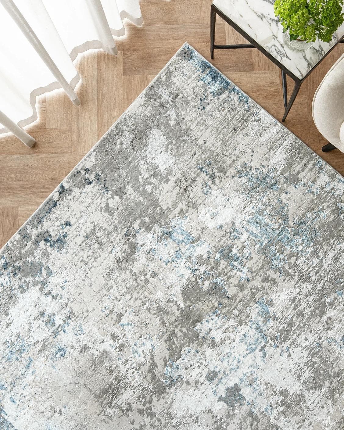 Jacob Sky carpet in blue and grey, shown in a lifestyle top view as image 2