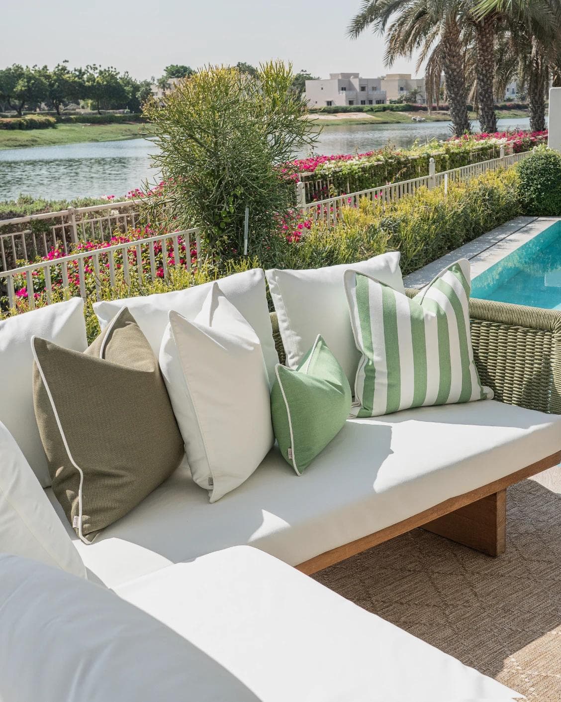Jalena Bundle cushion in green and ivory, shown in a lifestyle left view as image 2