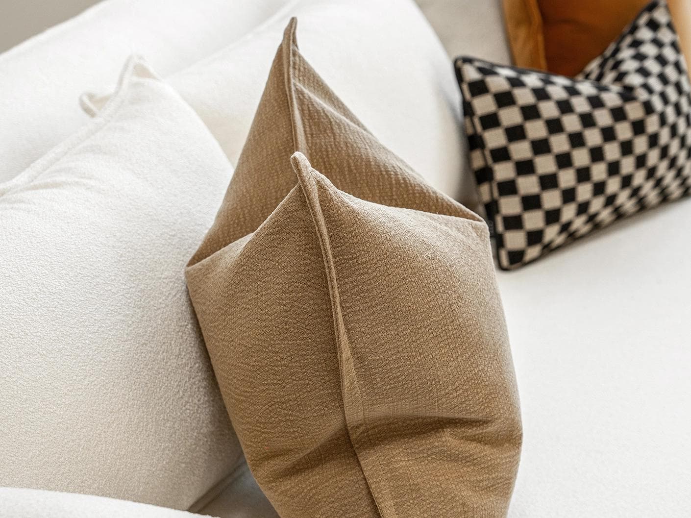 Jancil Bundle cushion in black and orange, shown in a product left view as image 7