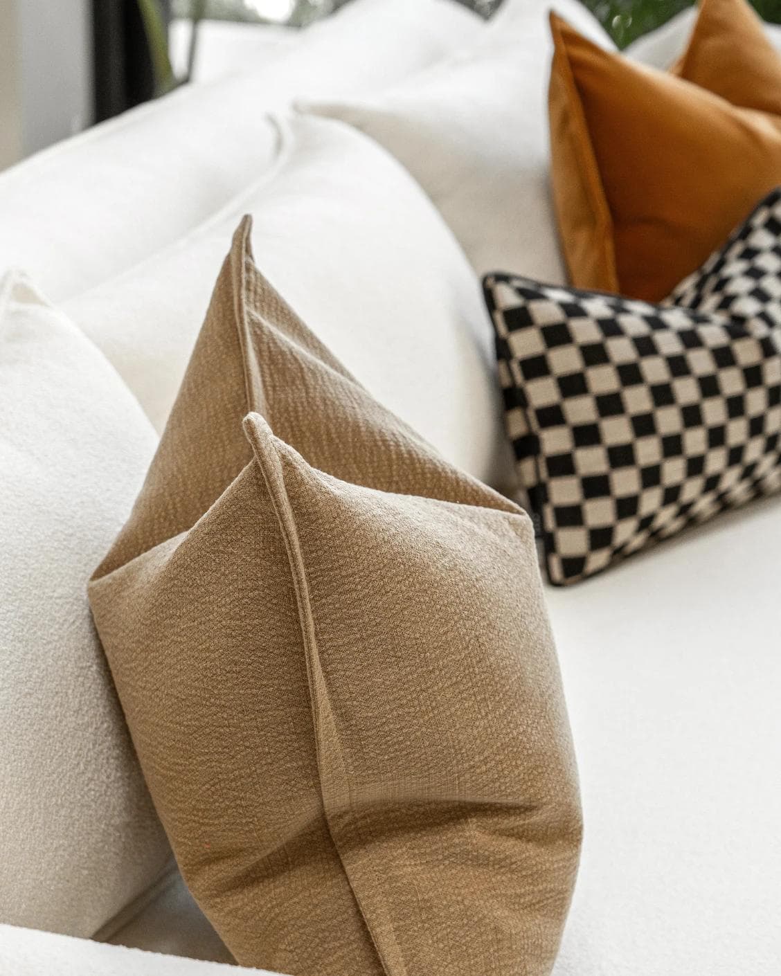 Jancil Bundle cushion in black and orange, shown in a product left view as image 7