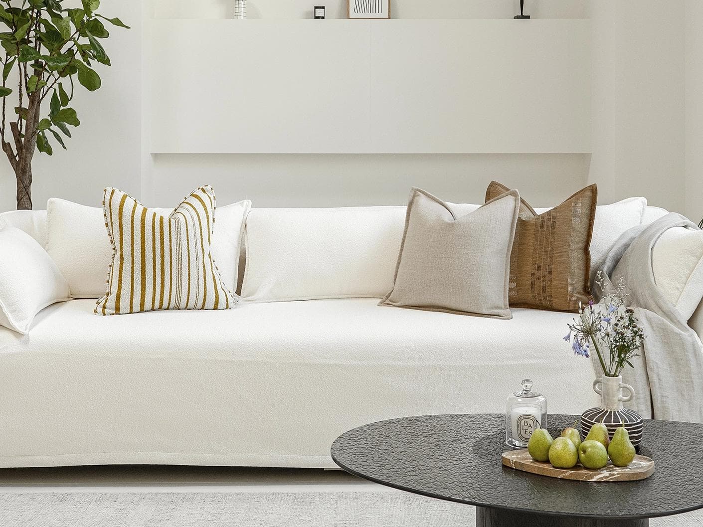 Janina Bundle cushion in beige and cream, shown in a lifestyle front view as image 4