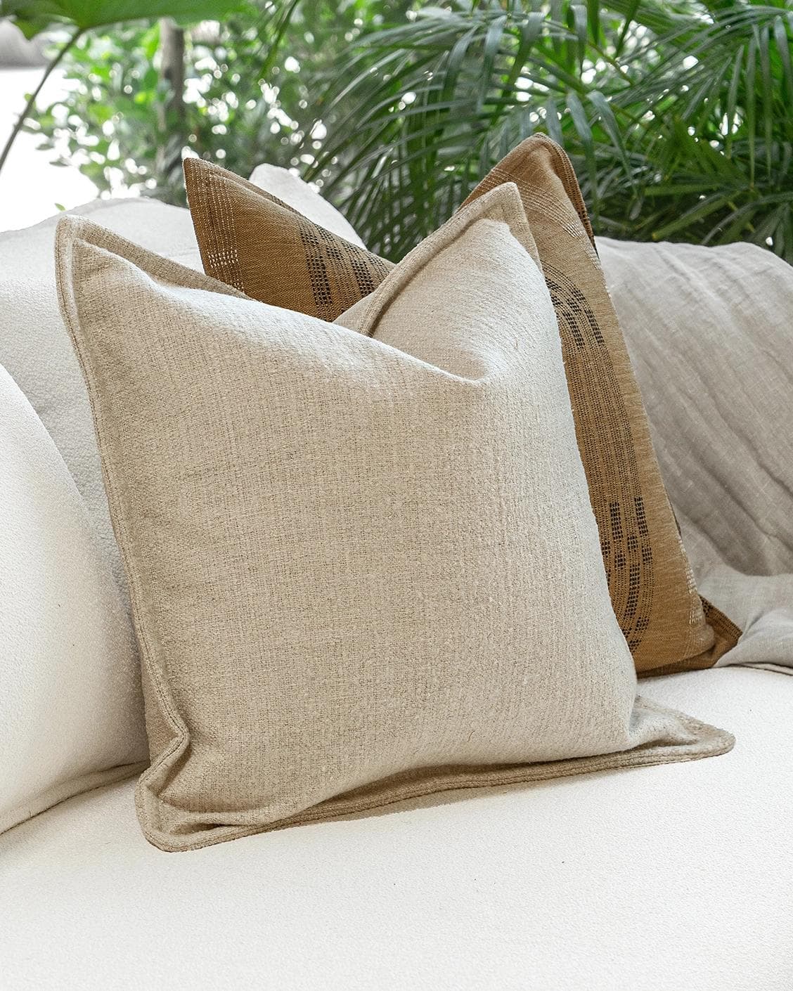 Janina Bundle cushion in beige and cream, shown in a lifestyle left view as image 5