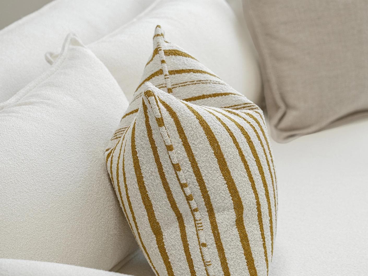 Janina Bundle cushion in beige and cream, shown in a product left view as image 6