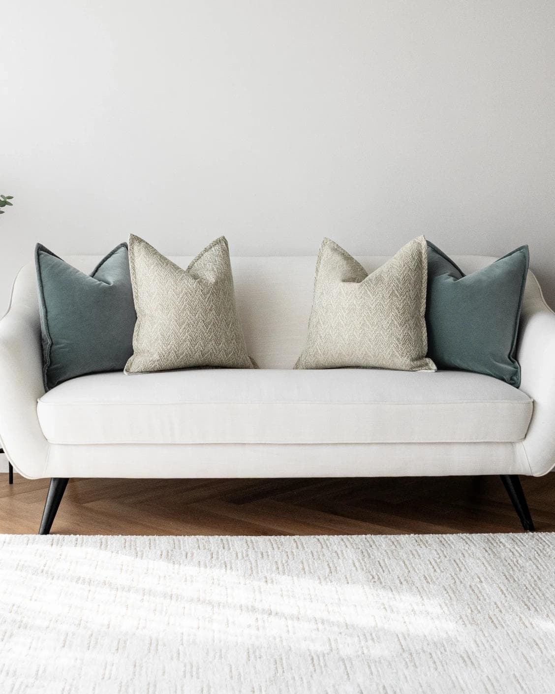 Jastine Bundle cushion in blue and beige, shown in a lifestyle front view as image 4