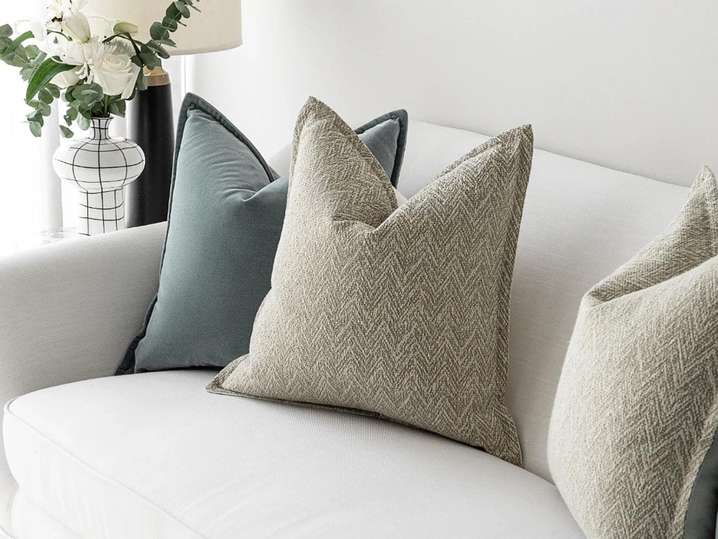 Jastine Bundle cushion in blue and beige, shown in a lifestyle right view as image 5