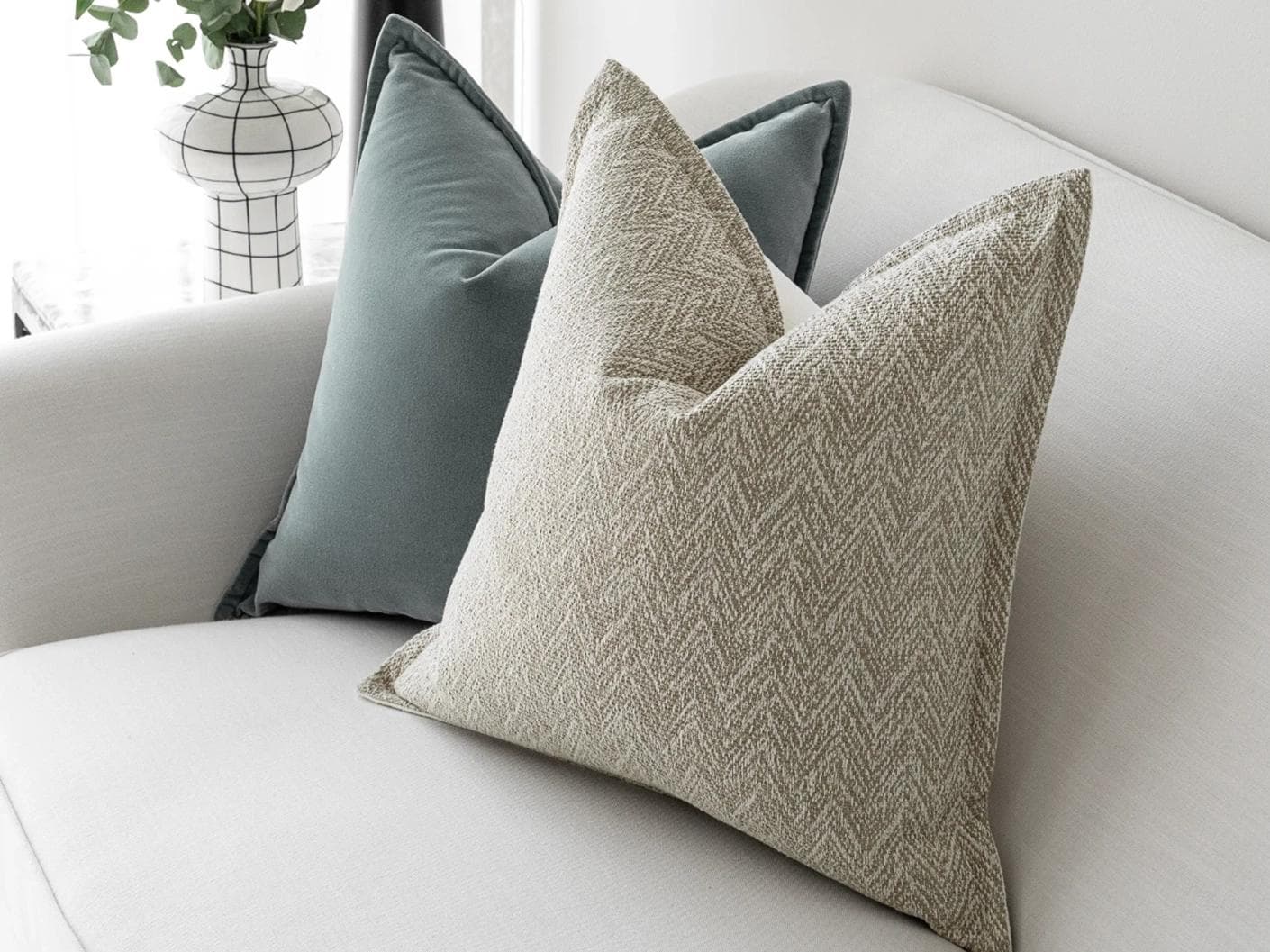 Jastine Bundle cushion in blue and beige, shown in a lifestyle right view as image 6