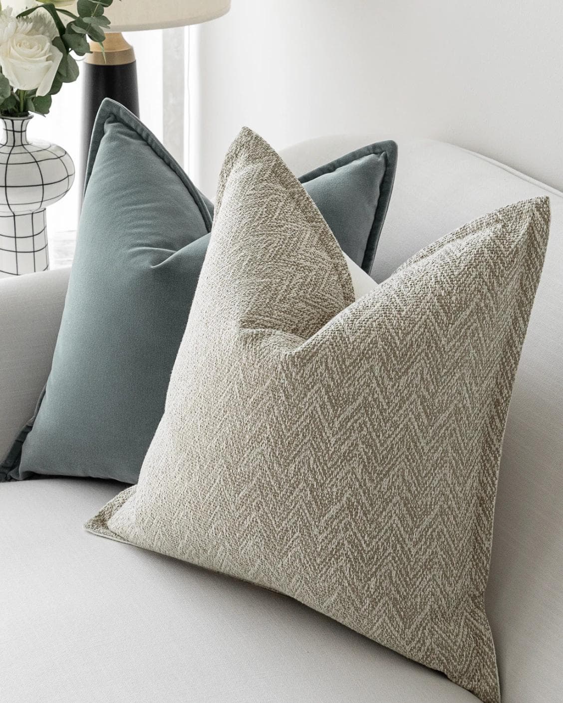 Jastine Bundle cushion in blue and beige, shown in a lifestyle right view as image 6