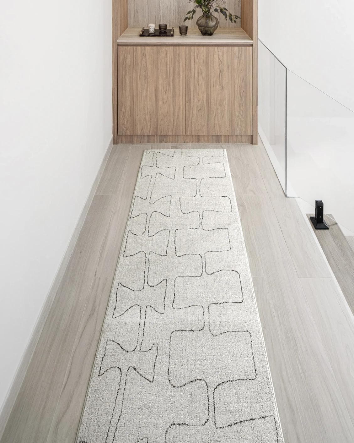 Jaxon Bianca Runners carpet in ivory and charcoal, shown in a lifestyle front view