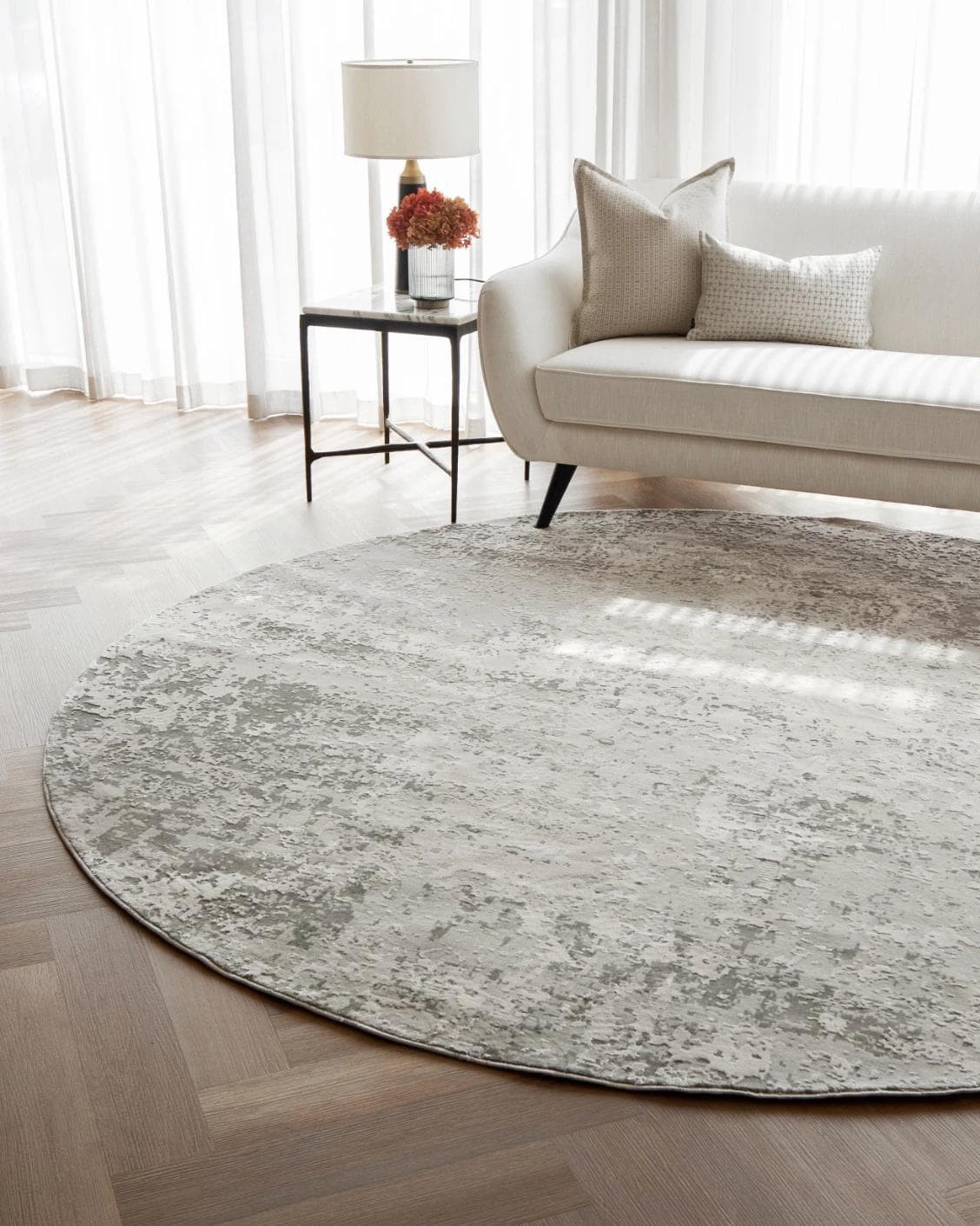 Jay Ashton Round carpet in grey, shown in a lifestyle front view as image 4