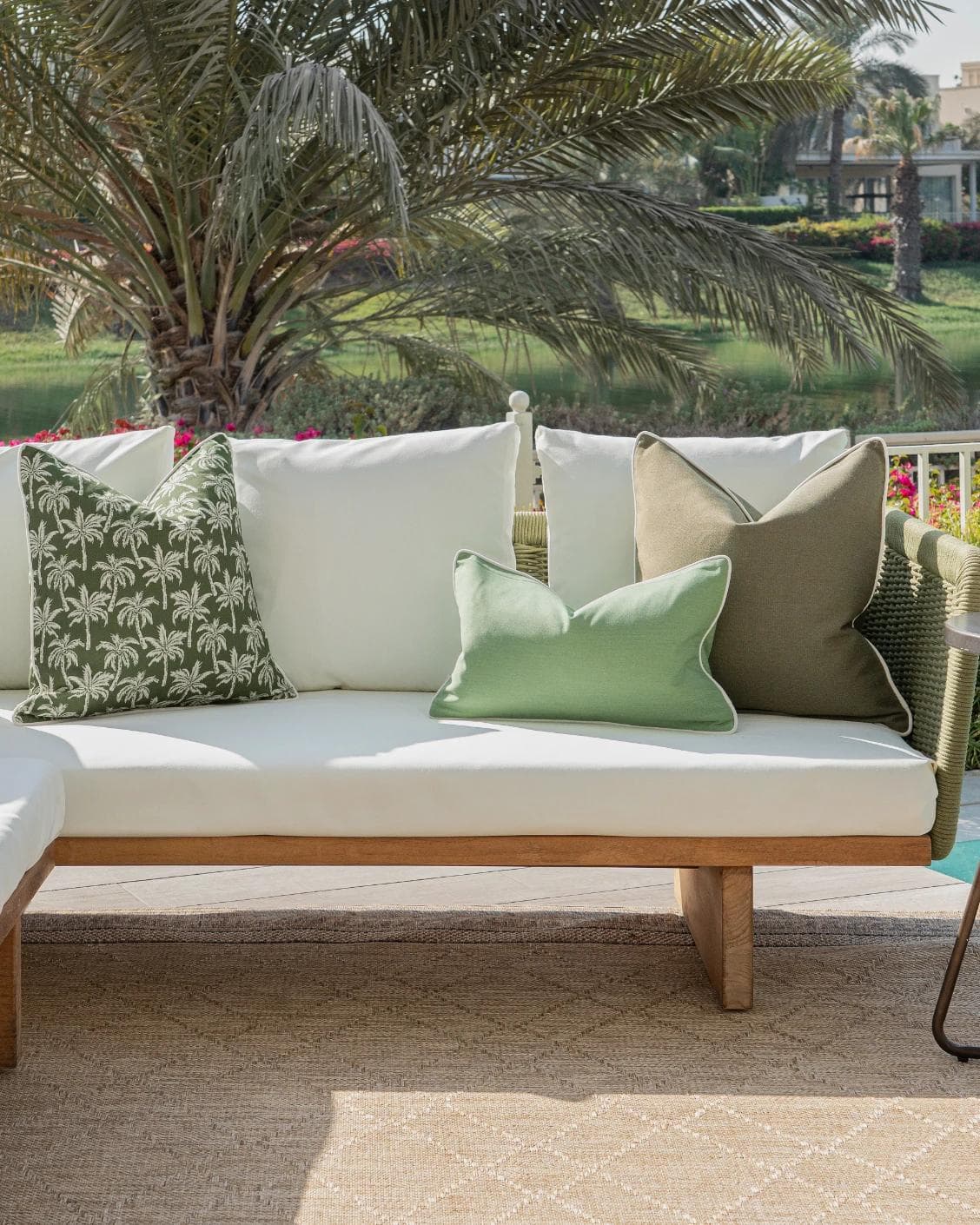 Jeeva Bundle cushion in green, shown in a lifestyle front view as image 4