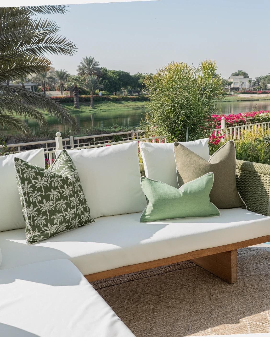 Jeeva Bundle cushion in green, shown in a lifestyle left view as image 2