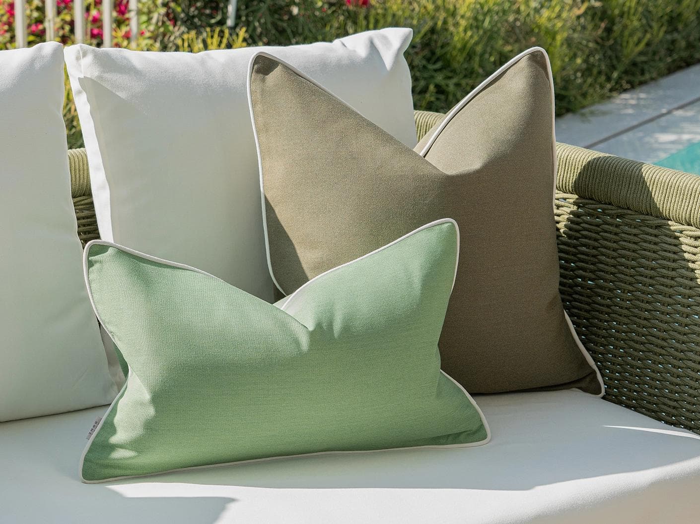 Jeeva Bundle cushion in green, shown in a lifestyle left view as image 5