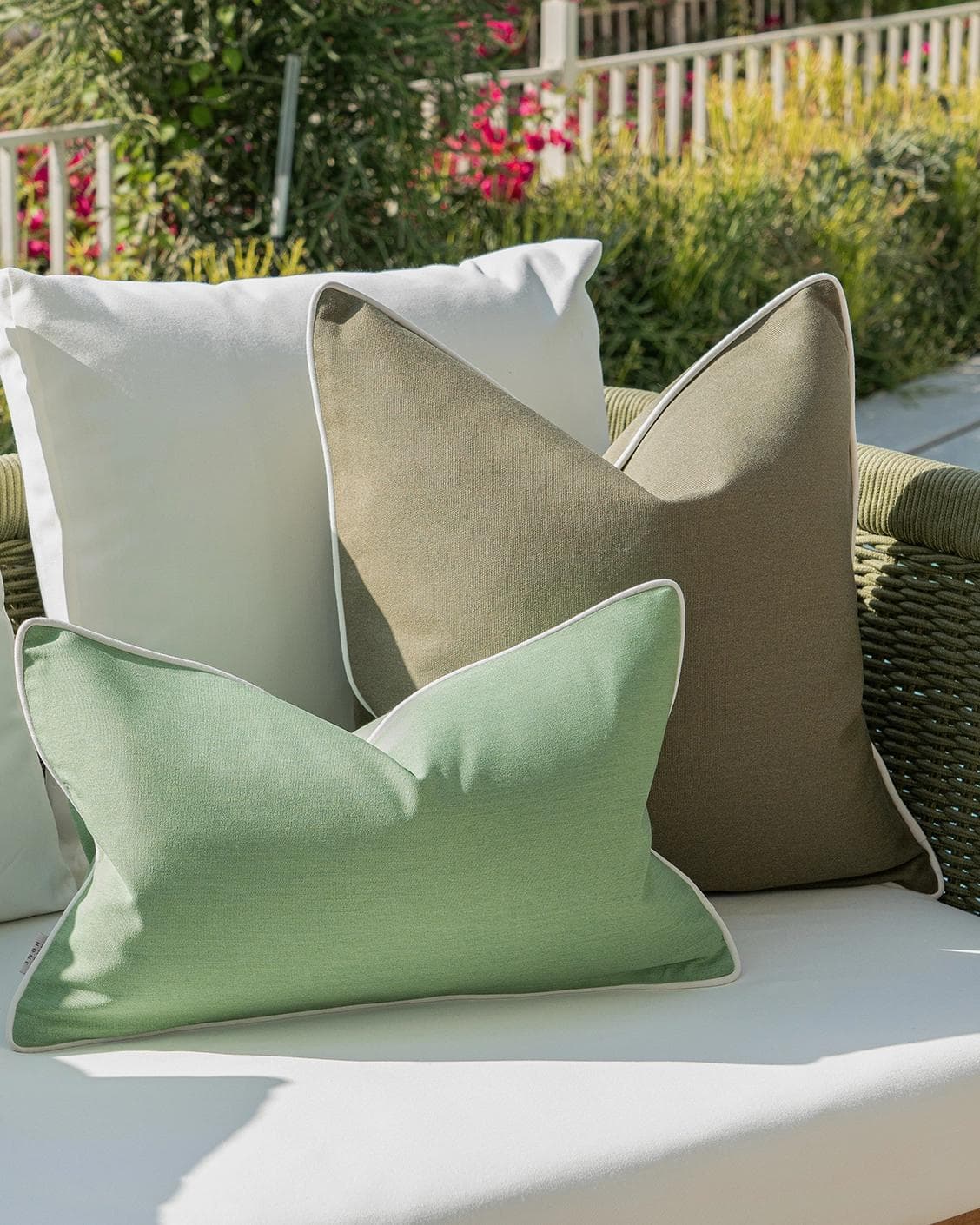 Jeeva Bundle cushion in green, shown in a lifestyle left view as image 5
