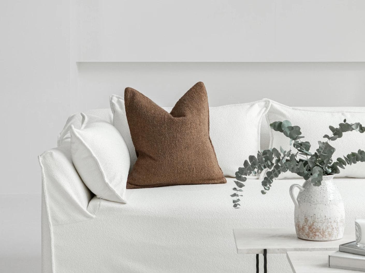 Jen Braun cushion in brown, shown in a lifestyle front view as image 4