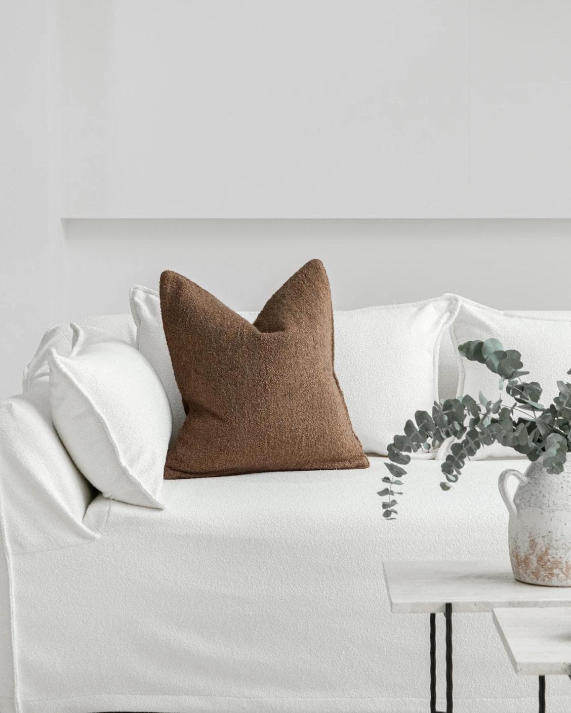 Jen Braun cushion in brown, shown in a lifestyle front view as image 4