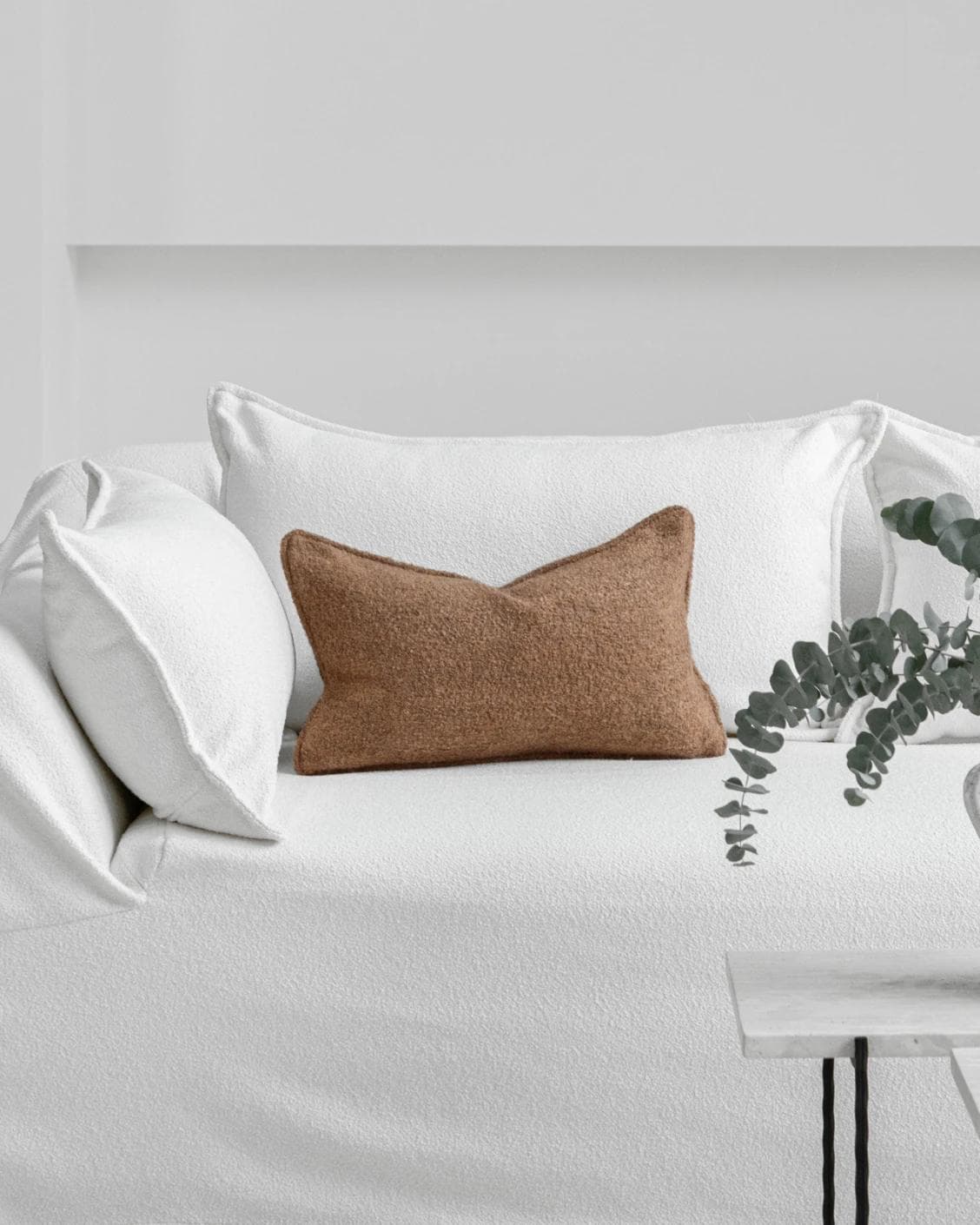 Jen Braun II cushion in brown, shown in a lifestyle front view as image 4