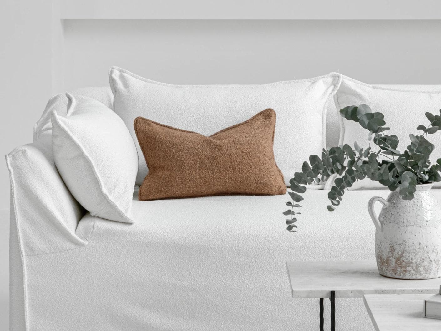 Jen Braun II cushion in brown, shown in a lifestyle front view as image 4