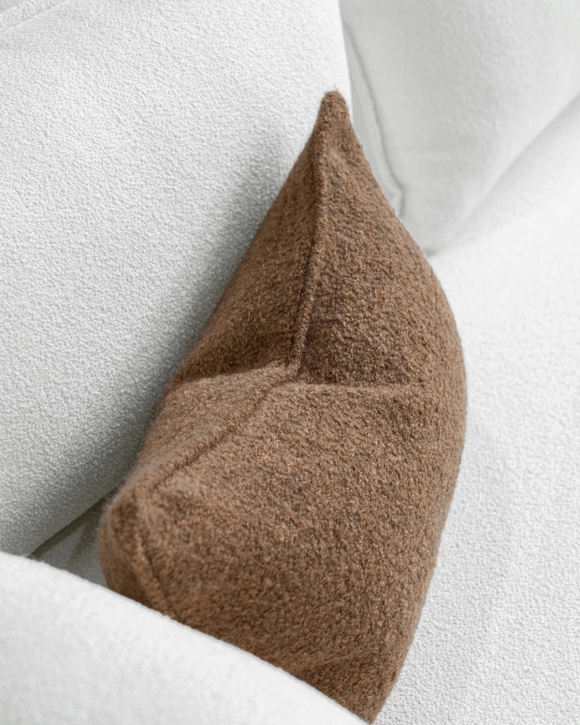Jen Braun II cushion in brown, shown in a lifestyle top view as image 5