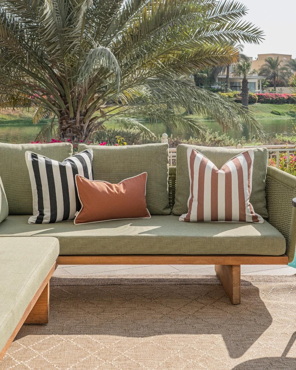 Jival Bundle cushion in black and rust, shown in a lifestyle front view as image 4