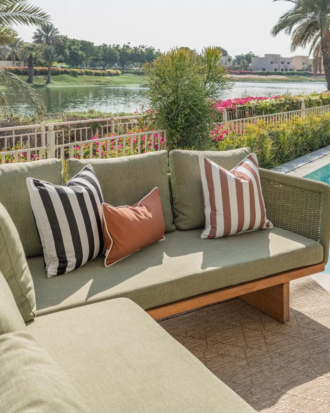 Jival Bundle cushion in black and rust, shown in a lifestyle left view as image 2