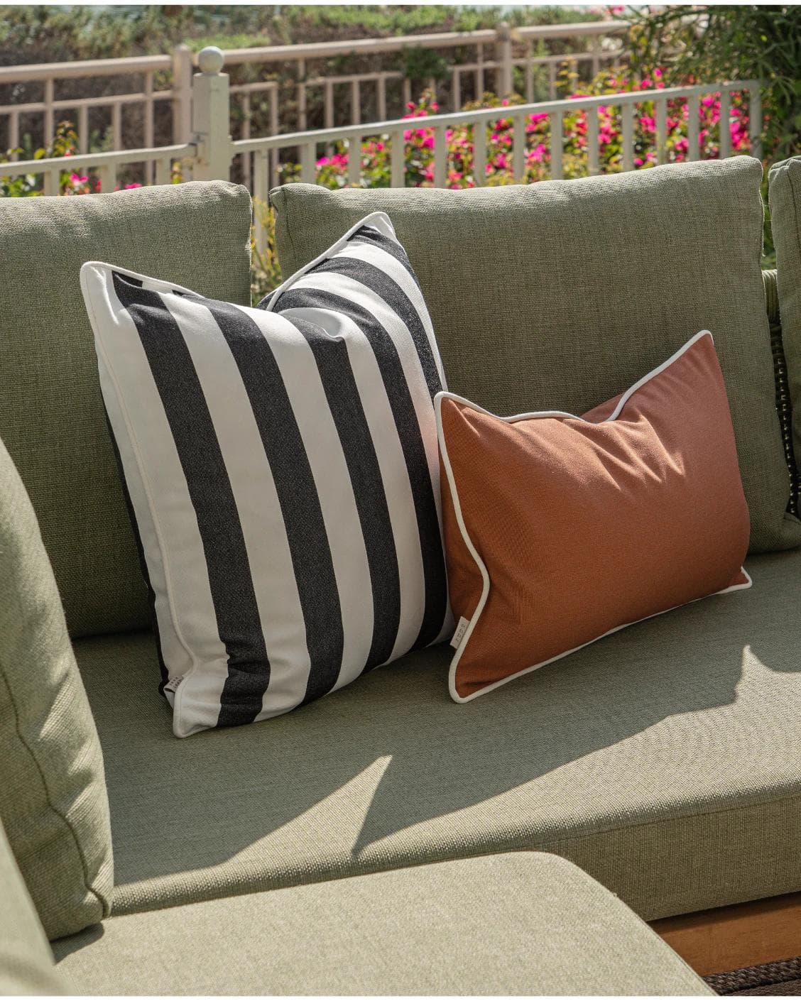 Jival Bundle cushion in black and rust, shown in a lifestyle left view as image 5