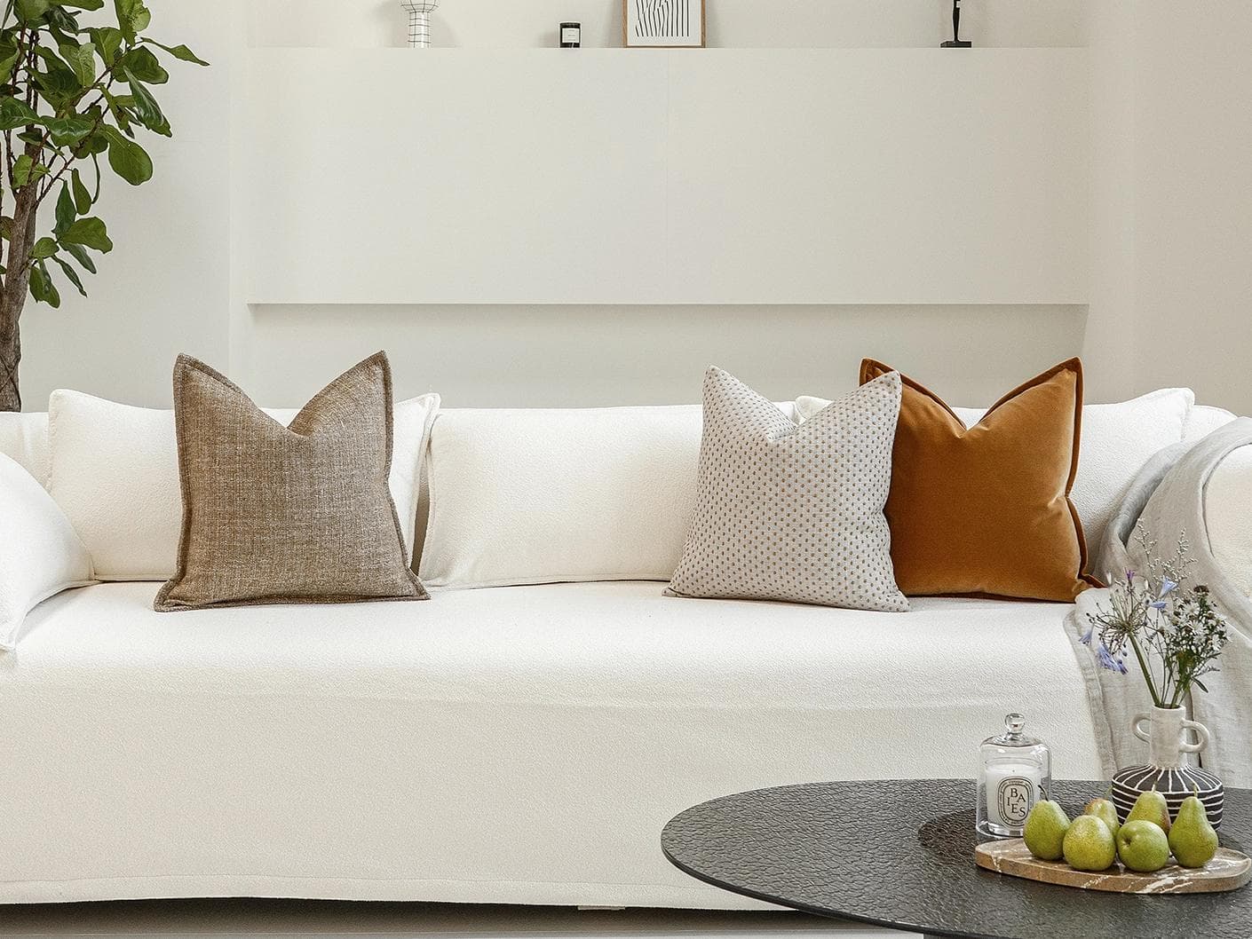 Jolvin Bundle cushion in orange and beige, shown in a lifestyle front view as image 4