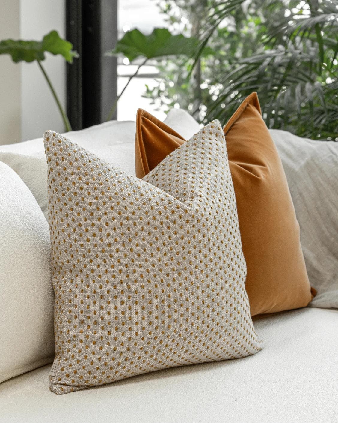 Jolvin Bundle cushion in orange and beige, shown in a lifestyle left view as image 6