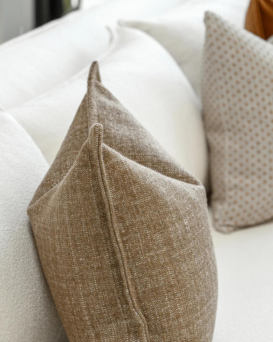 Jolvin Bundle cushion in orange and beige, shown in a product left view as image 7