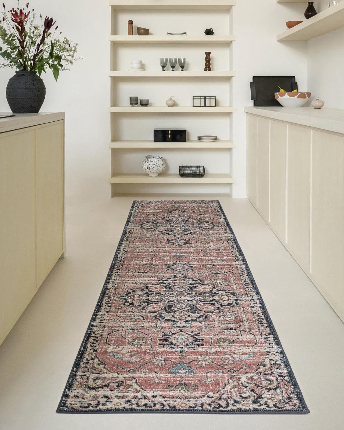 Julian Terracotta Runners carpet in grey and pink, shown in a lifestyle front view
