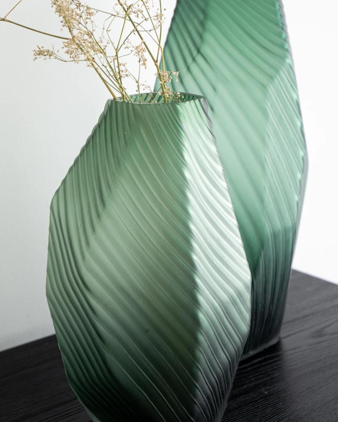 Keira Bundle vases in green, shown in a lifestyle left view as image 6