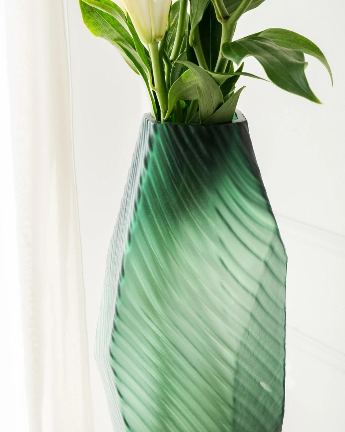 Keira Storms vases in green, shown in a lifestyle right view as image 6