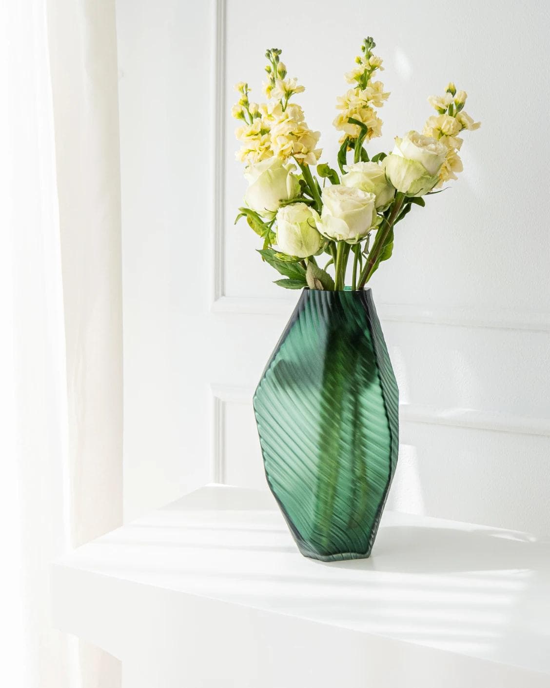 Keira Storms II vases in green, shown in a lifestyle right view as image 2