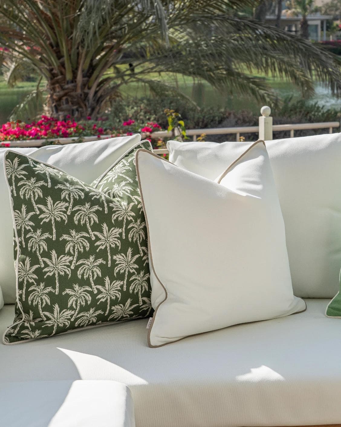Keyla Bundle cushion in green and ivory, shown in a lifestyle left view as image 5